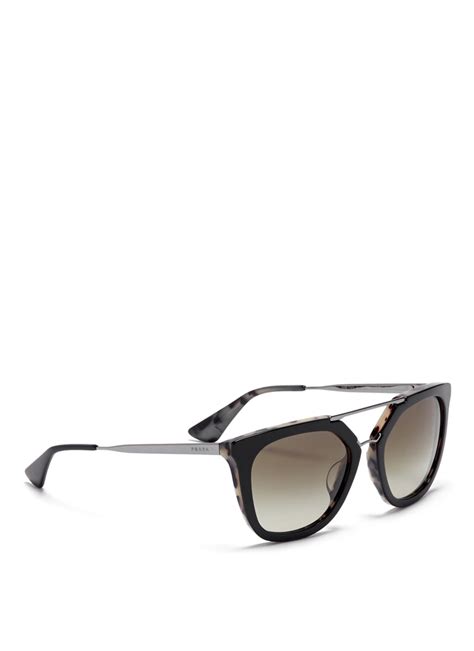 Prada Eyewear by Luxottica.